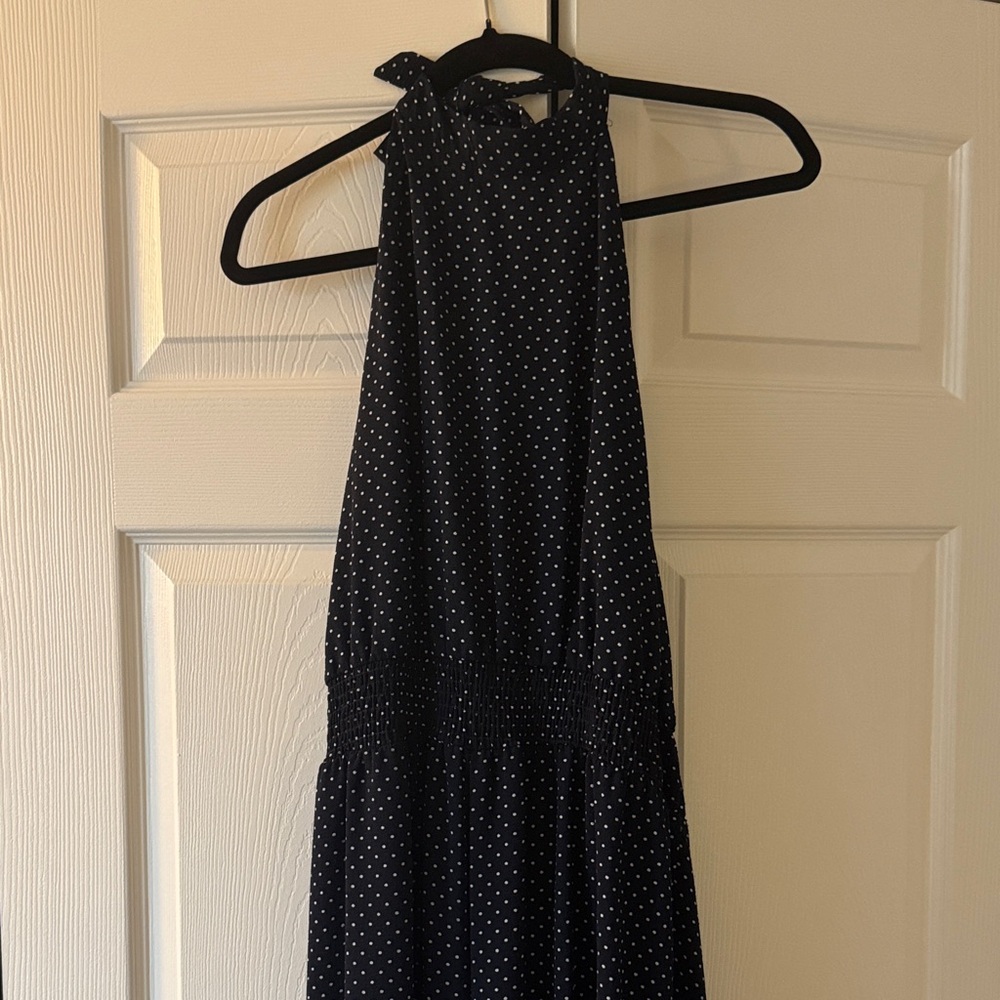 Halter jumpsuit in navy polka dot